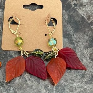 New handmade earrings, lady bug and glass leaves.